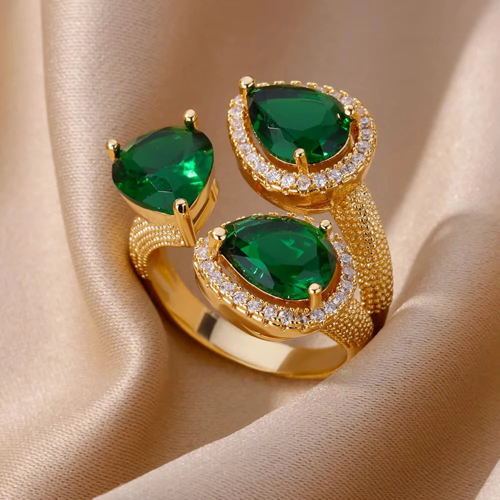 Bague de luxe en acier inoxydable avec zircon vert et fleur pour femme, style serpent, plaquée or, idéale pour un mariage ou une soirée. Bijou d'exception.