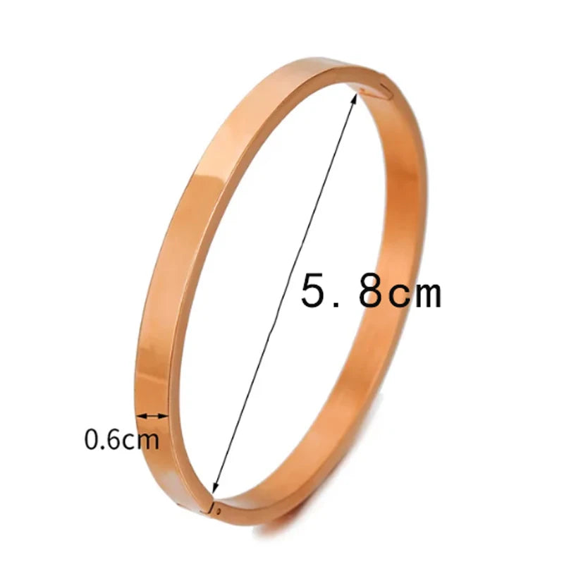 Bracelet jonc ovale tendance en acier inoxydable pour femme et enfant, bijou à breloques, cadeau idéal pour les fêtes, mariages et autres occasions spéciales. Vente en gros.