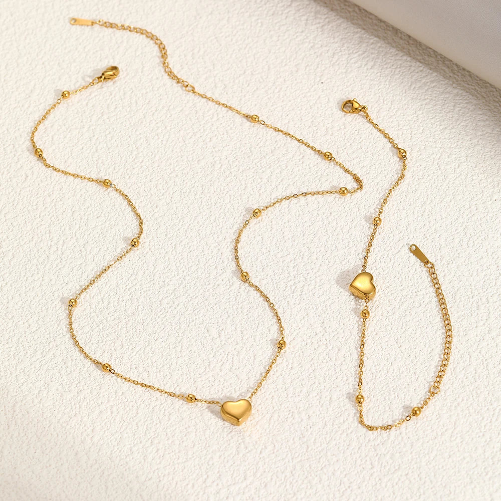 Ensemble de bijoux DOTIFI en acier inoxydable, collier et bracelet avec pendentif cœur stéréoscopique. Bijou simple et tendance, idéal pour les femmes. Cadeau parfait.