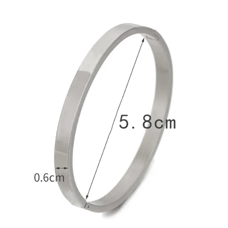 Bracelet jonc ovale tendance en acier inoxydable pour femme et enfant, bijou à breloques, cadeau idéal pour les fêtes, mariages et autres occasions spéciales. Vente en gros.