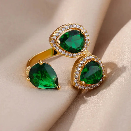 Bague de luxe en acier inoxydable avec zircon vert et fleur pour femme, style serpent, plaquée or, idéale pour un mariage ou une soirée. Bijou d'exception.