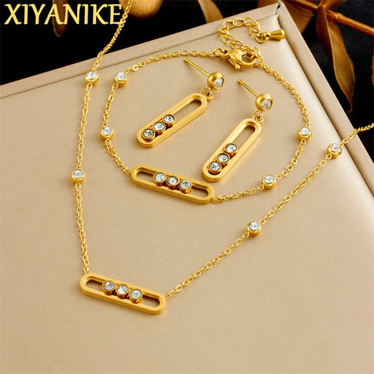 XIYANIKE Ensemble collier, bracelet et boucles d'oreilles en acier inoxydable 316L, forme rectangulaire arrondie, orné de cristaux blancs mobiles. Idée cadeau pour femme.